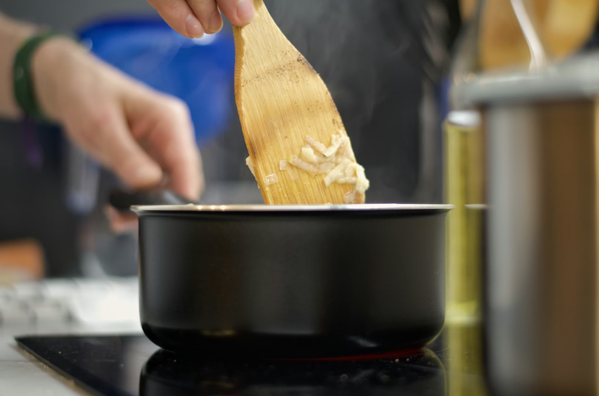 A man cooking in the utensil