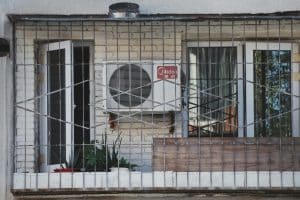 an air conditioner sitting on the side of a building