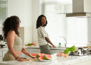 Roommates in the kitchen cooking together