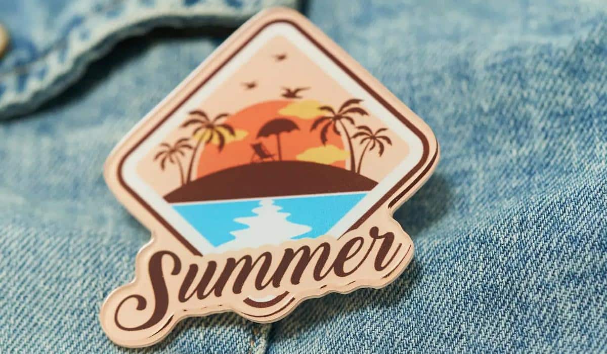 Summer beach sunset enamel pin on blue denim jacket