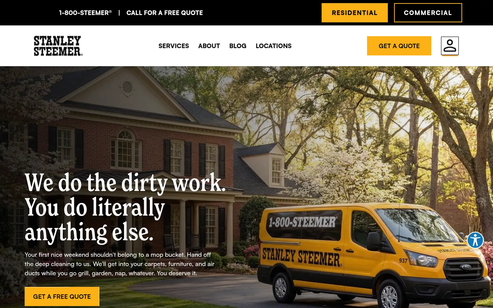 Yellow Stanley Steemer van parked in front of large brick house with trees nearby