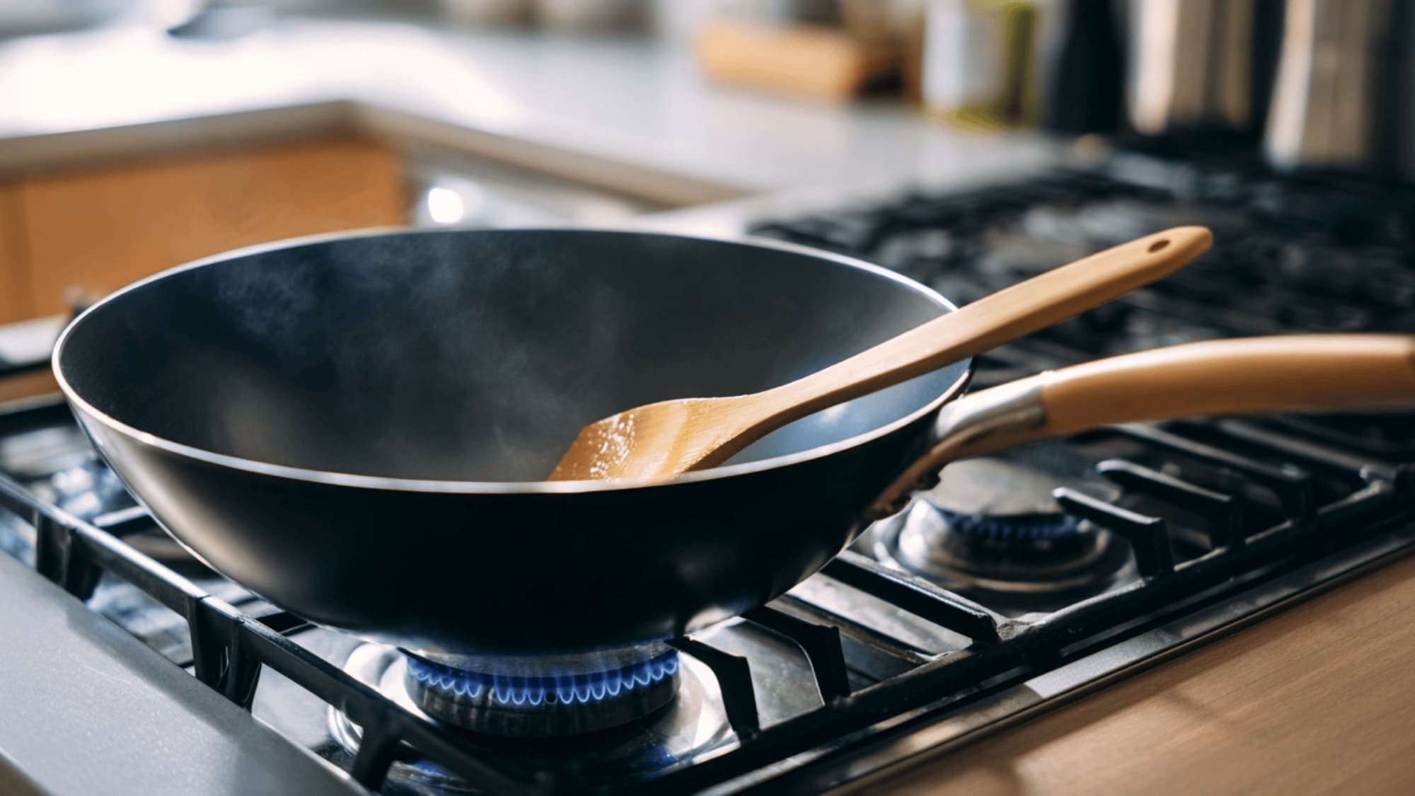 Empty wok heating on a gas stove before cooking stir-fry vegetables
