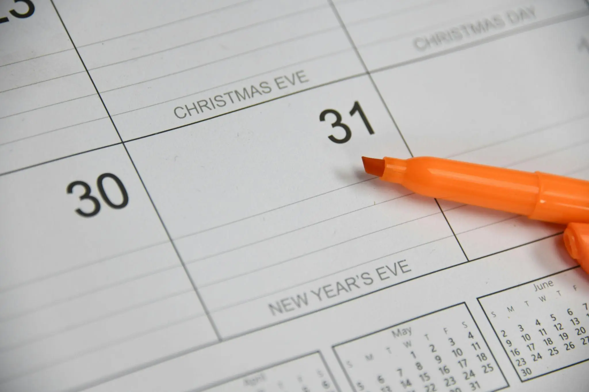 Calendar page highlighting December 31 with orange marker, labeled New Year's Eve