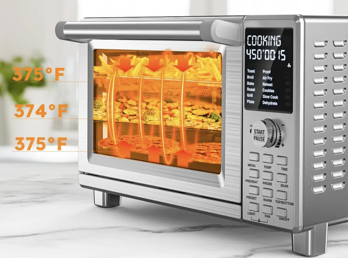 Stainless steel convection oven cooking fries and pizza with digital temperature display on countertop