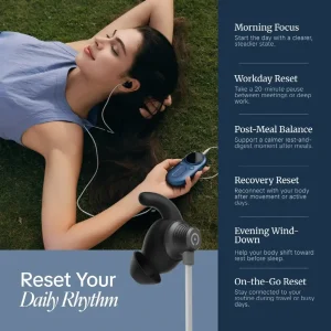 Woman relaxing on grass with earphones and blue music player under daylight