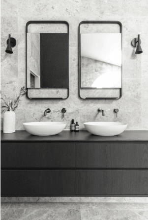 Modern double sink bathroom vanity with black fixtures and wall-mounted mirrors