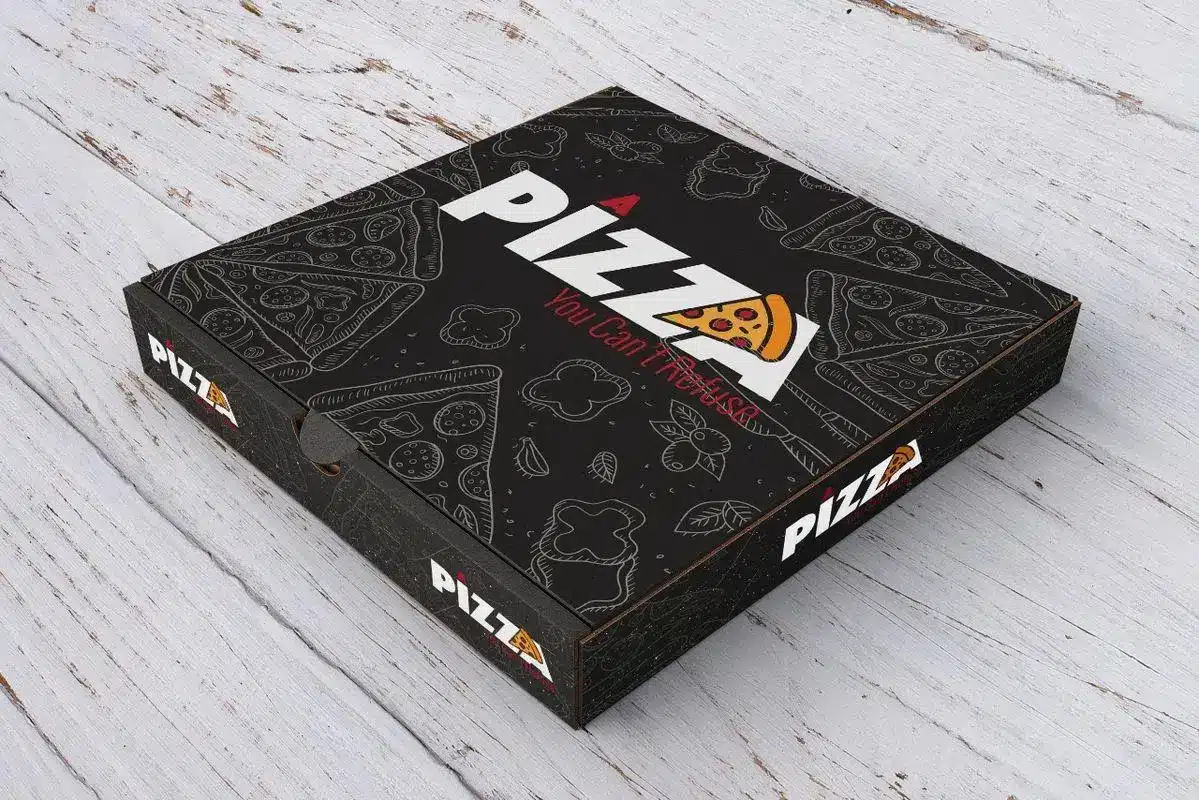 Black pizza box with white and red text on rustic wooden surface